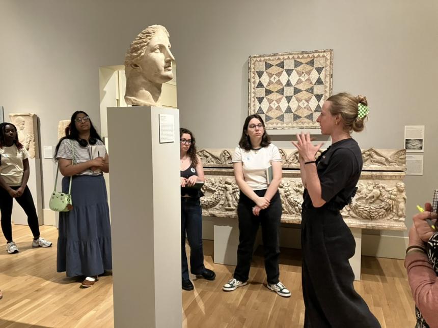 Students in a museum filled with antiquities
