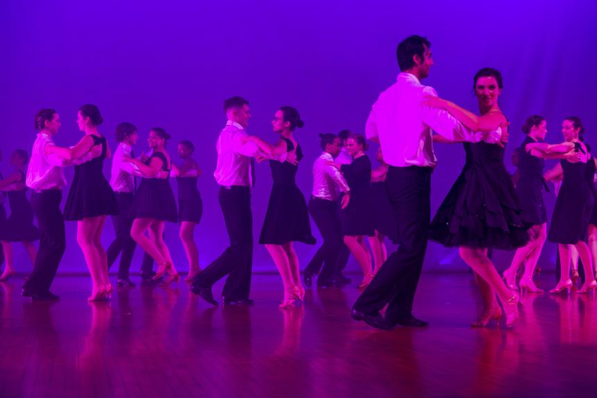 The UGA ballroom dance group dancing in black and white outfits