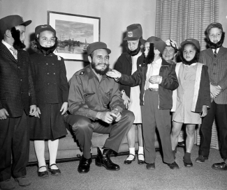 Photo of Cuban leader Catro and children wearing fake beards