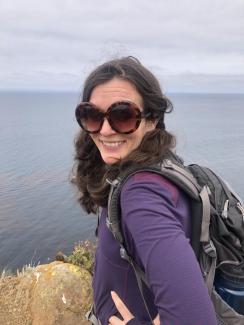 photo of Dr. Elizabeth Tandy Shermer by the shoreline in view of water