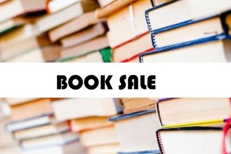 image of many books and book sale sign