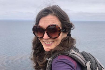 photo of Dr. Elizabeth Tandy Shermer by the shoreline in view of water