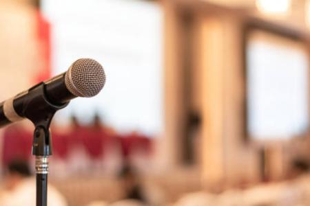 Photo of a microphone in a lecture hall