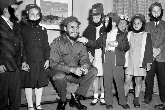 Photo of Cuban leader Catro and children wearing fake beards