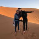 Image of doctoral student Maggie Neel in the desert (with a friend)